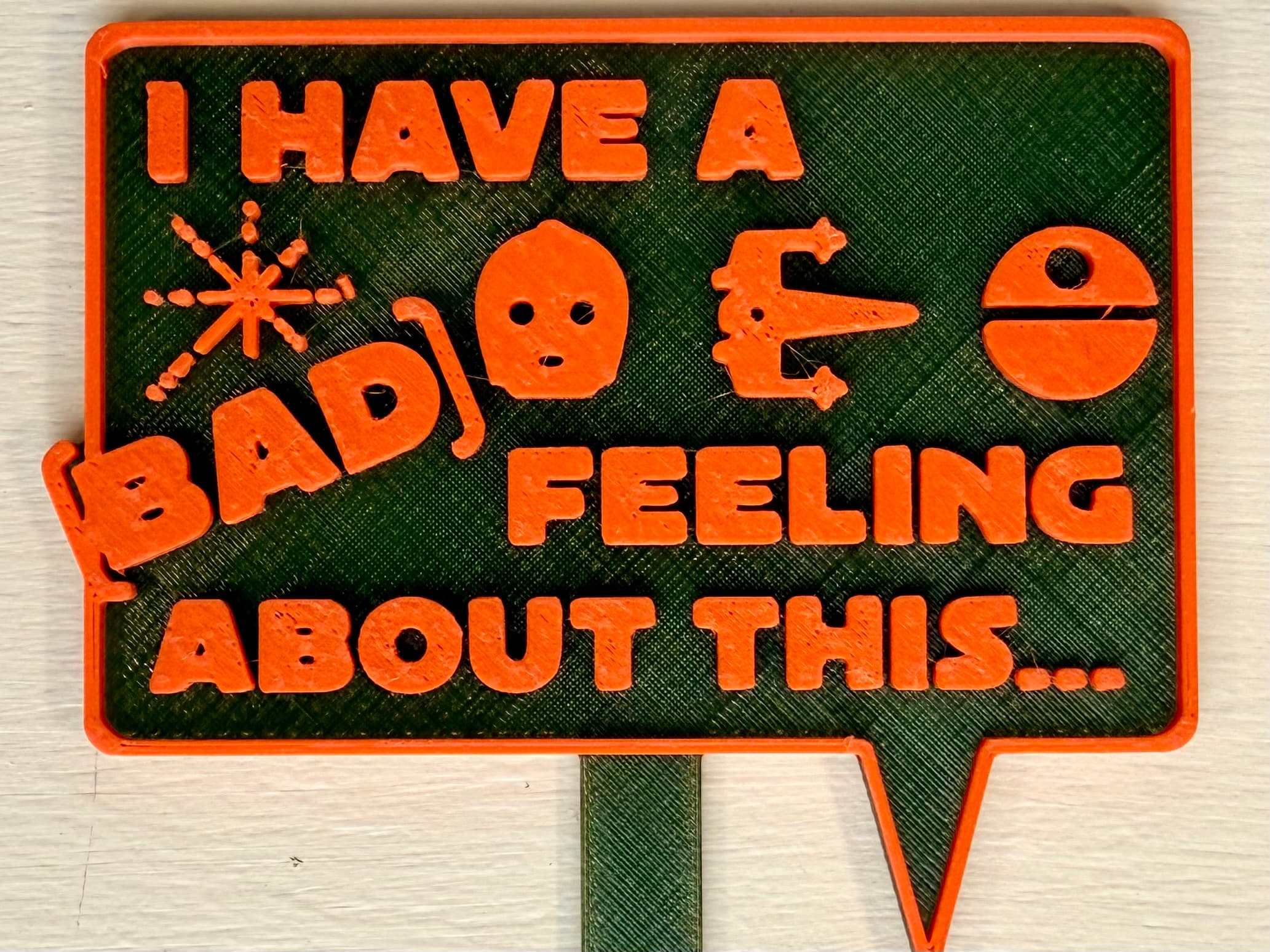 3D-printed pot pick with raised text reading 'I Have a Bad Feeling About This'