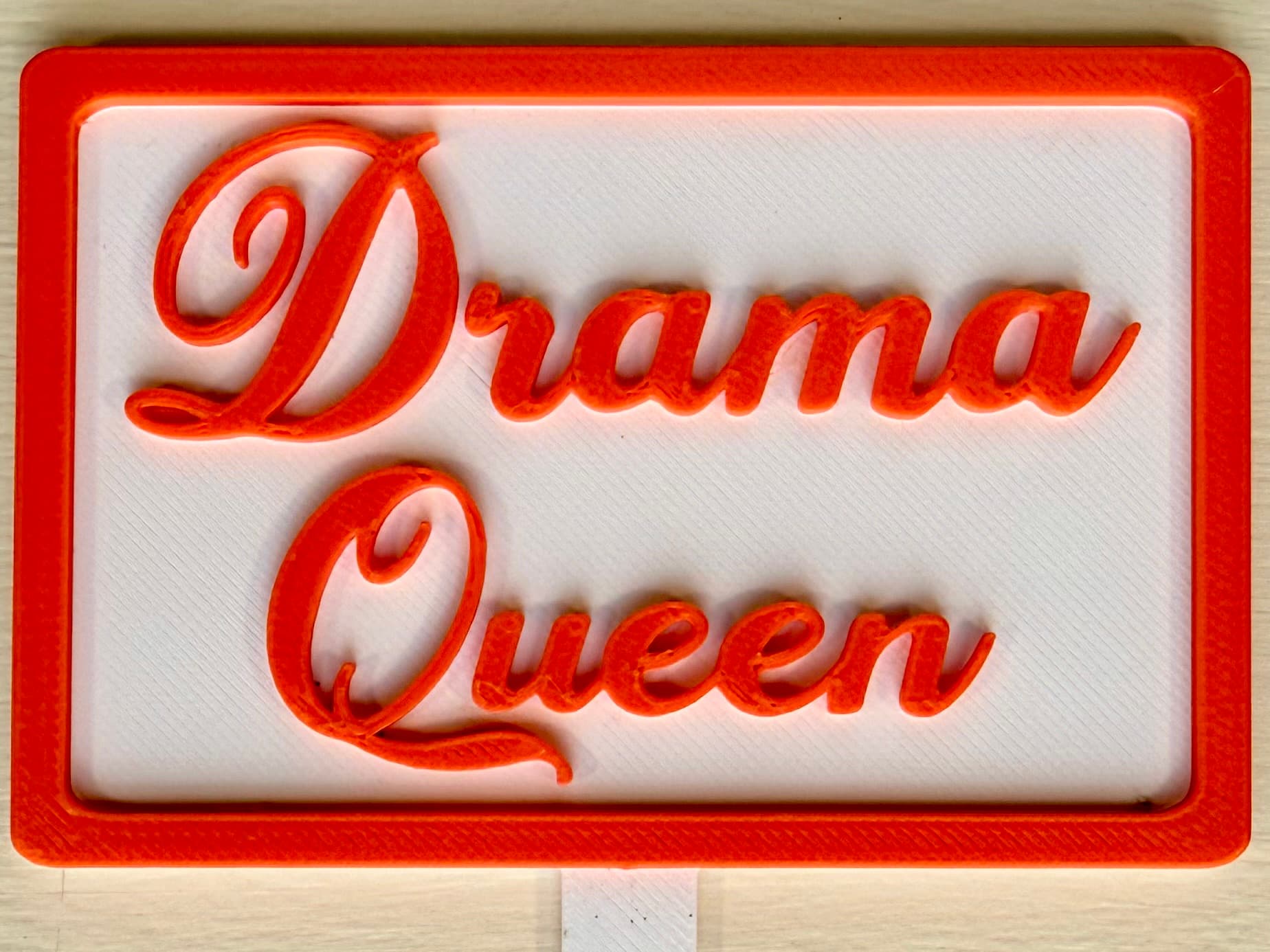 3D-printed pot pick with raised text reading 'Drama Queen'