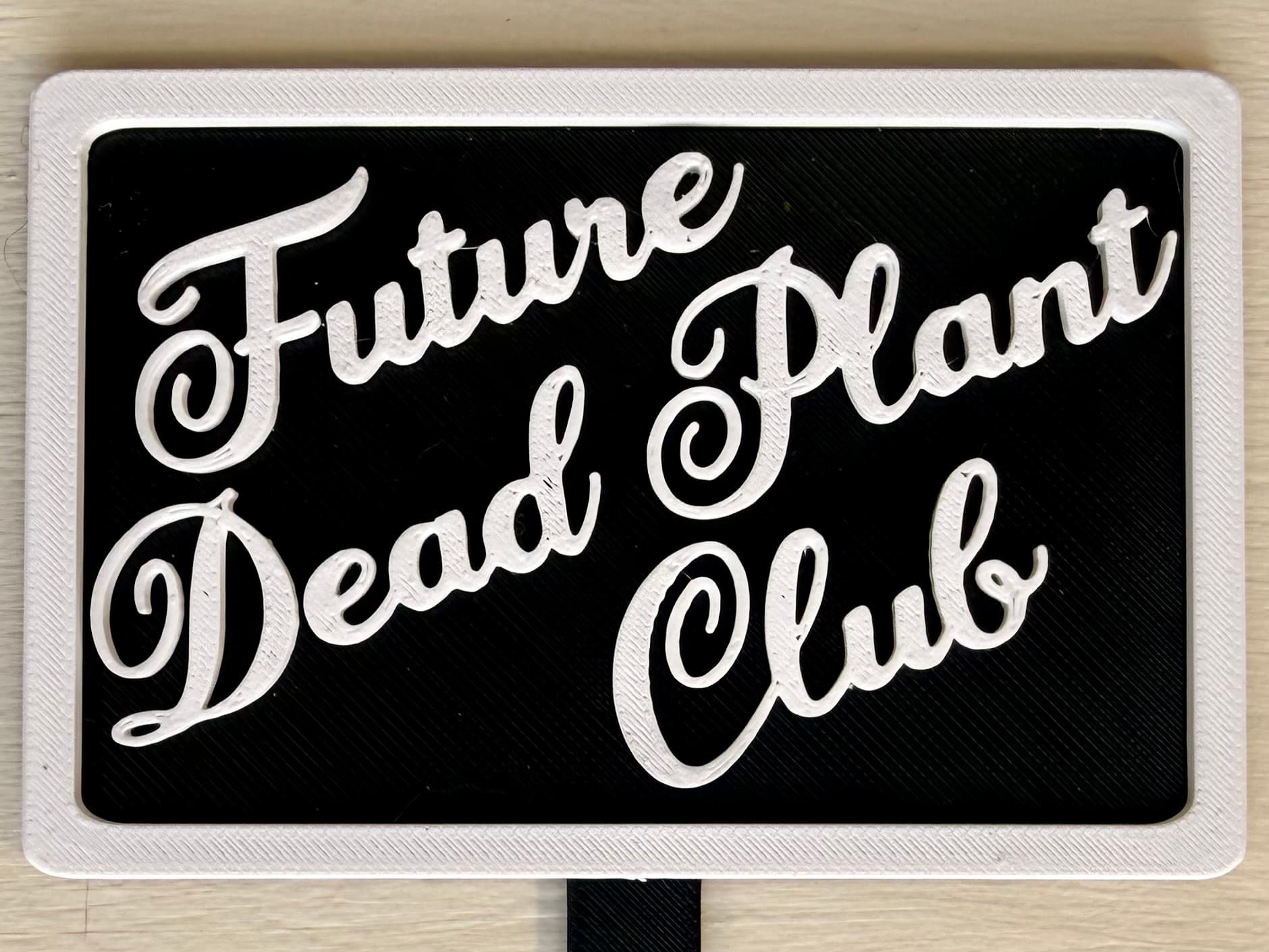 3D-printed pot pick with raised text reading 'Future Dead Plant Club'