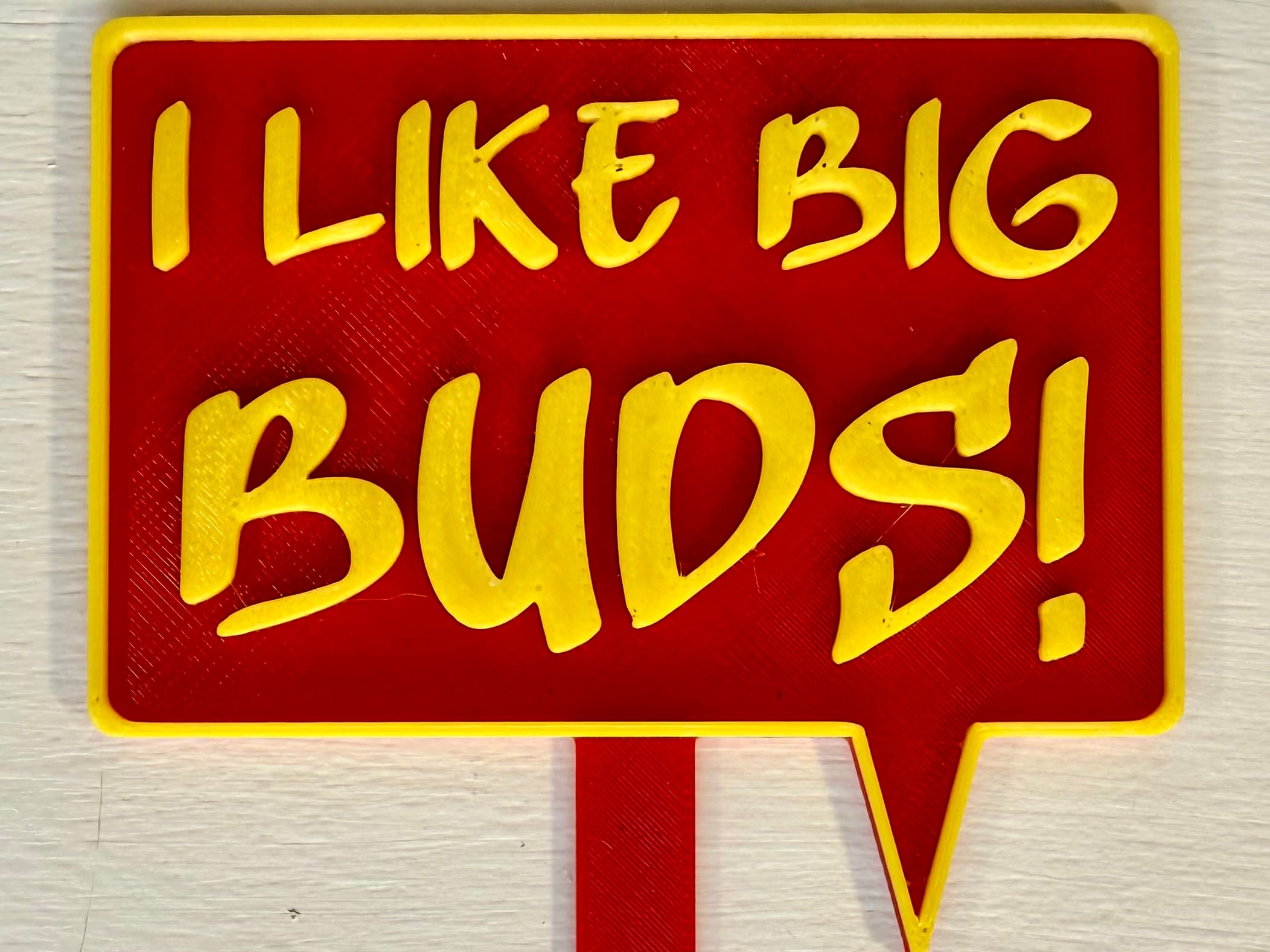 3D-printed pot pick with raised text reading 'I Like Big Buds!'