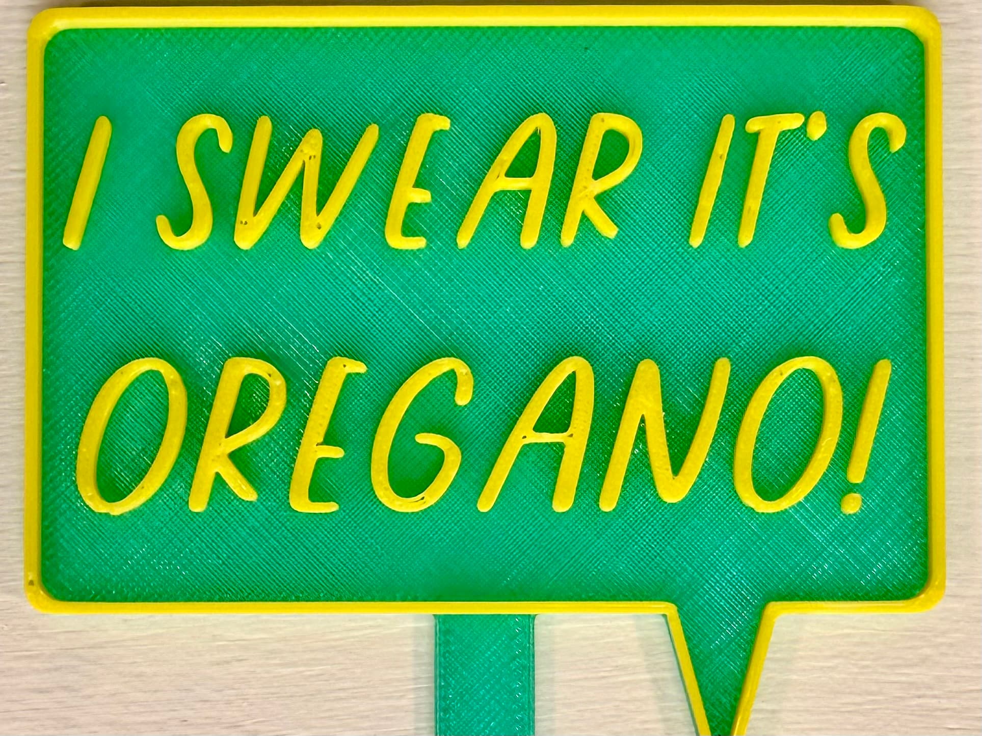 3D-printed pot pick with raised text reading 'I Swear It's Oregano'