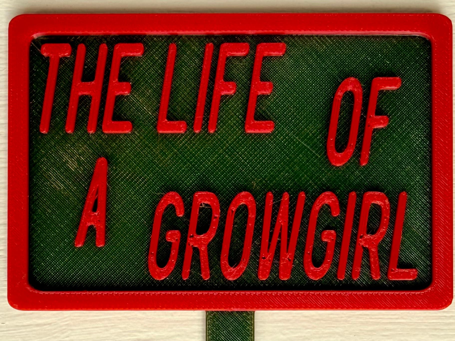 3D-printed pot pick with raised text reading 'The Life of a Grow Girl'