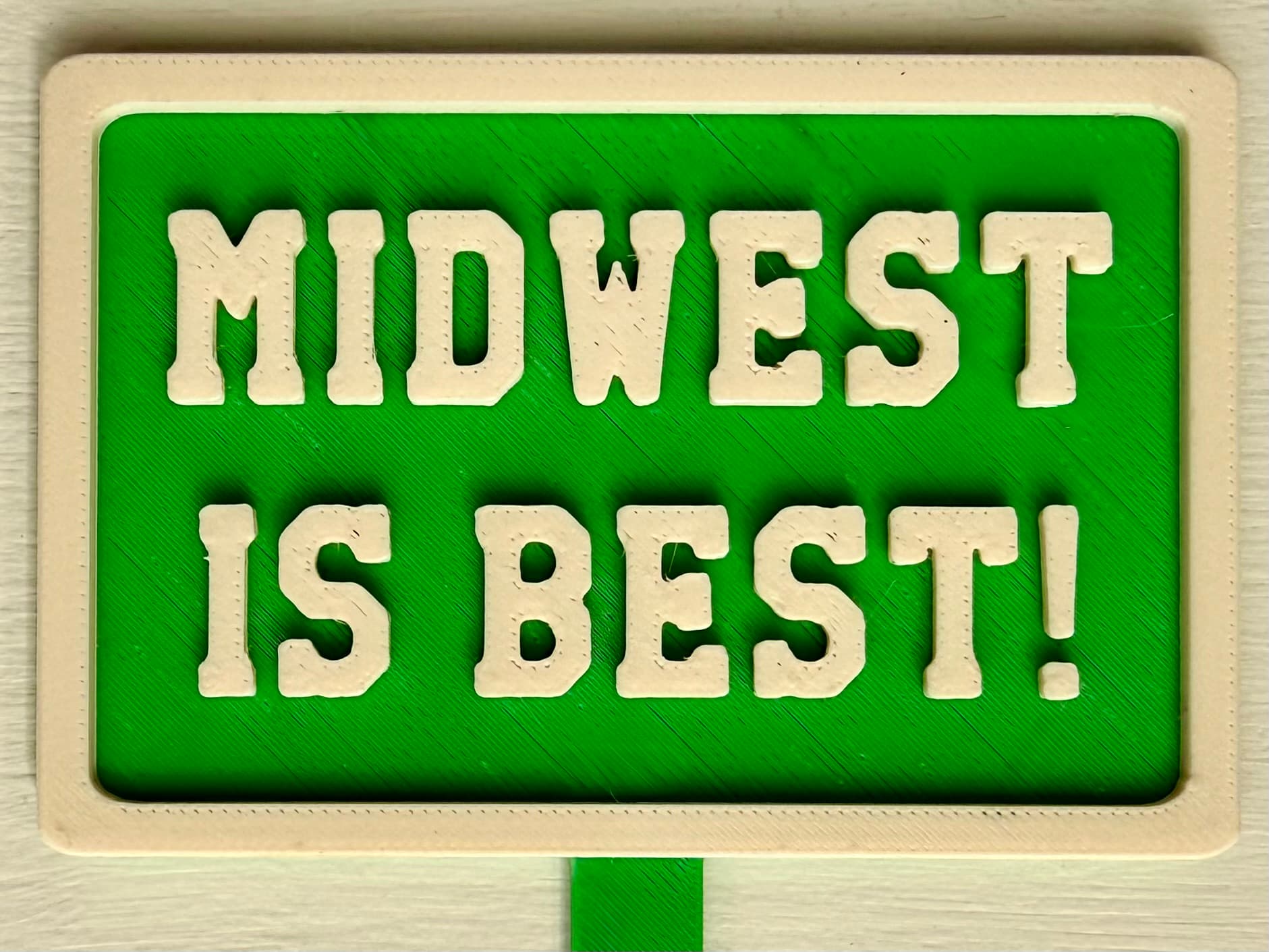 3D-printed pot pick with raised text reading 'Midwest Is Best'