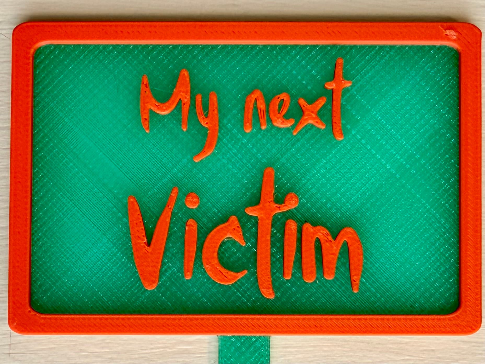 3D-printed pot pick with raised text reading 'My Next Victim'