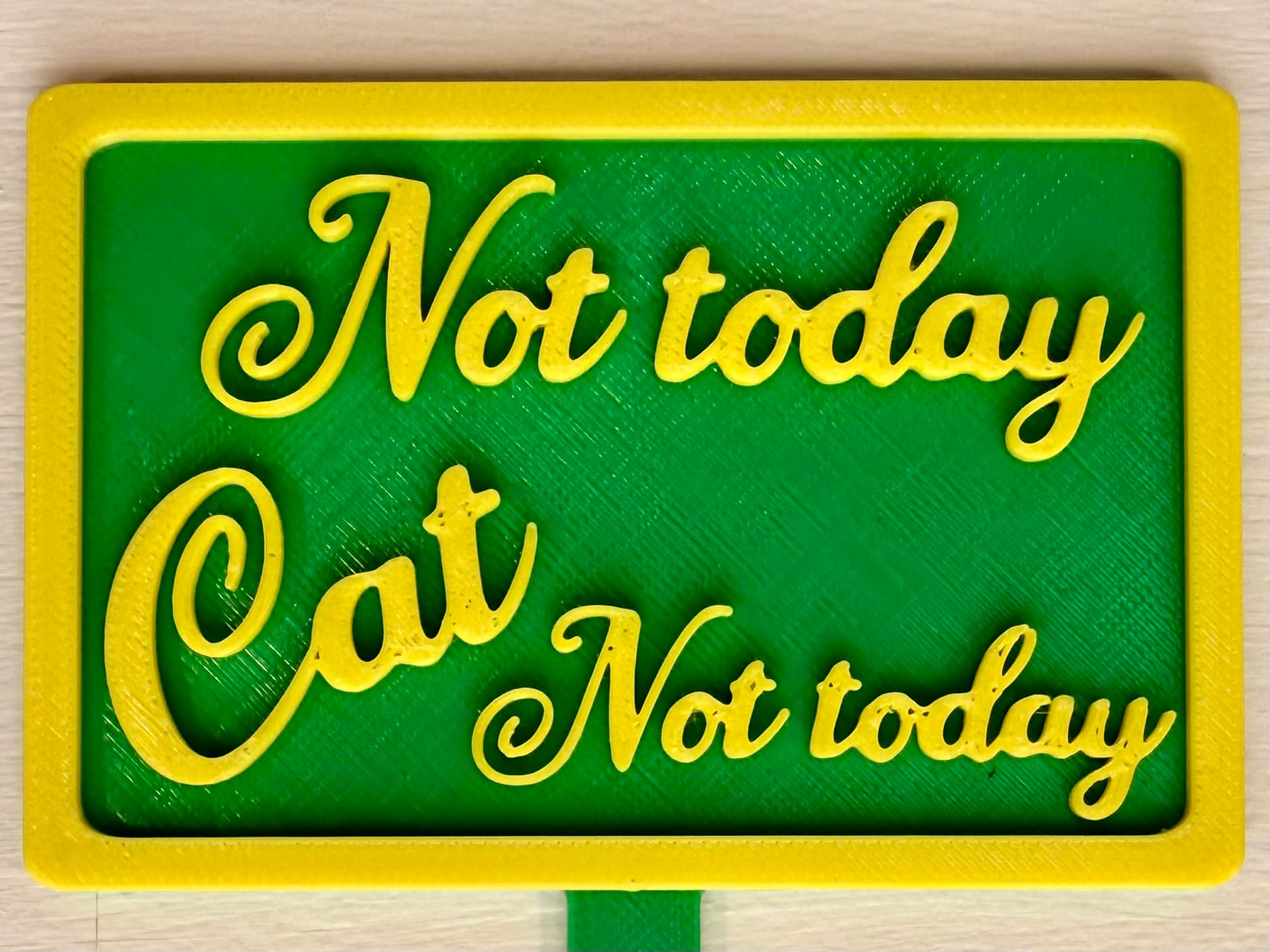 3D-printed pot pick with raised text reading 'Not Today Cat, Not Today!'