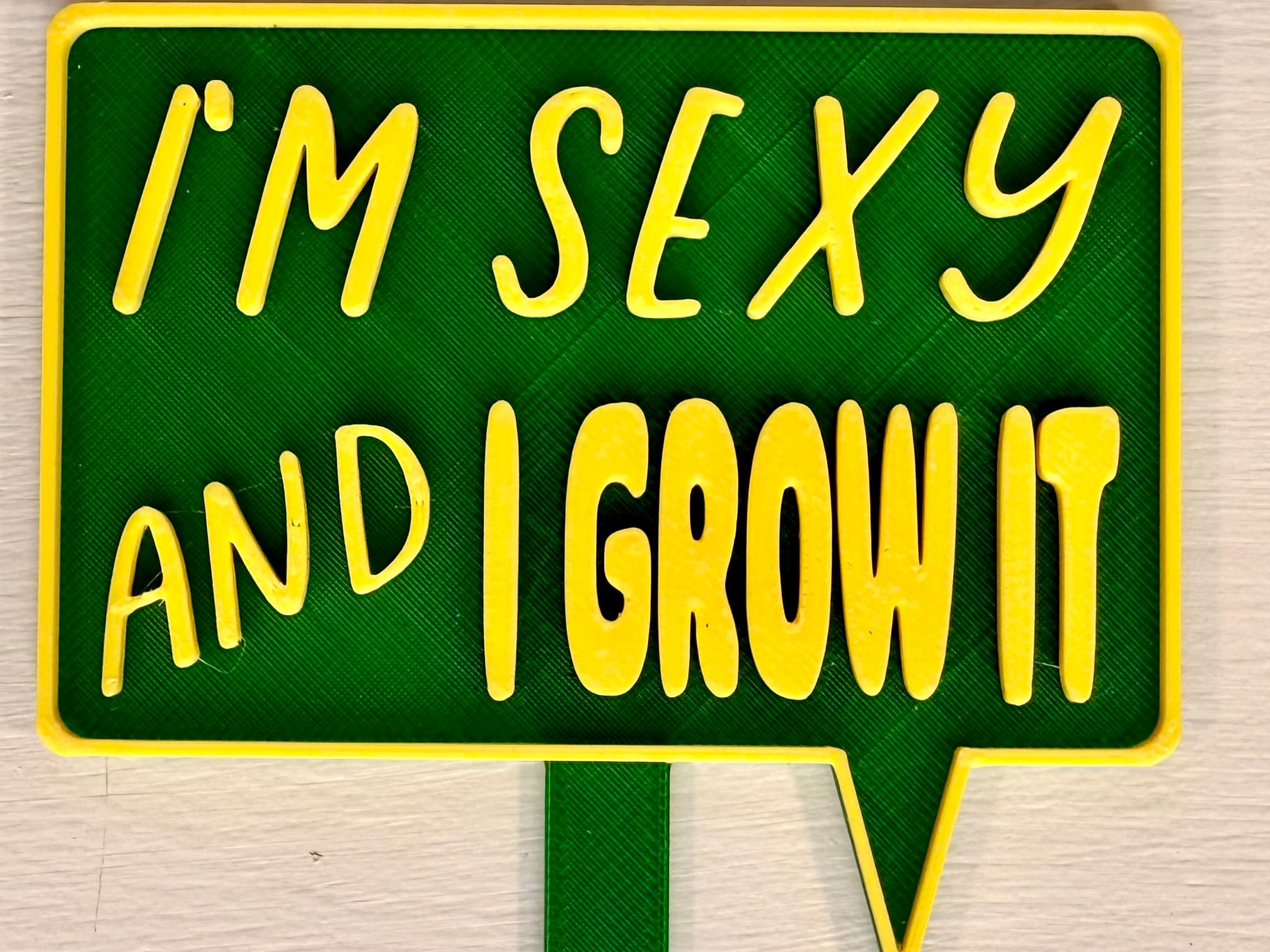 3D-printed pot pick with raised text reading 'I'm Sexy and I Grow It!'